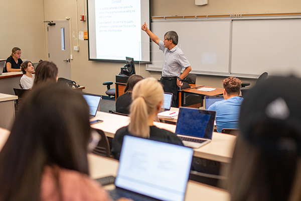 Teacher in front of a class room of students