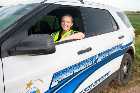 Emergency management student in a car