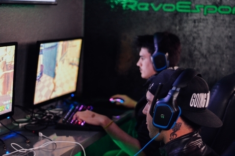 Esports gamers at computers playing games