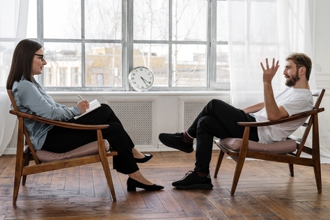Social worker talking to a patient