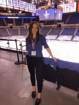 Olivia Franks - Adelphi Alum - standing in an arena