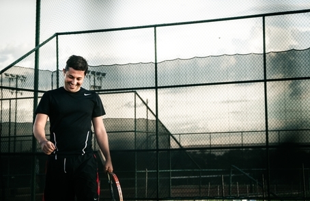 Sports Management professional playing tennis